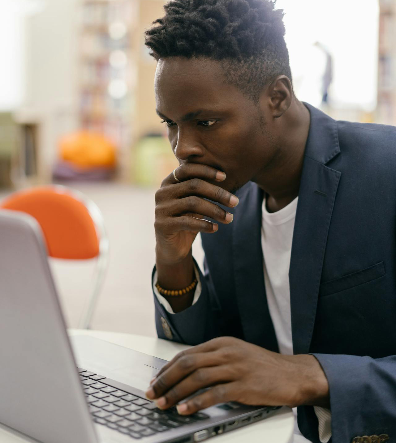 Student operating a Computer for Research